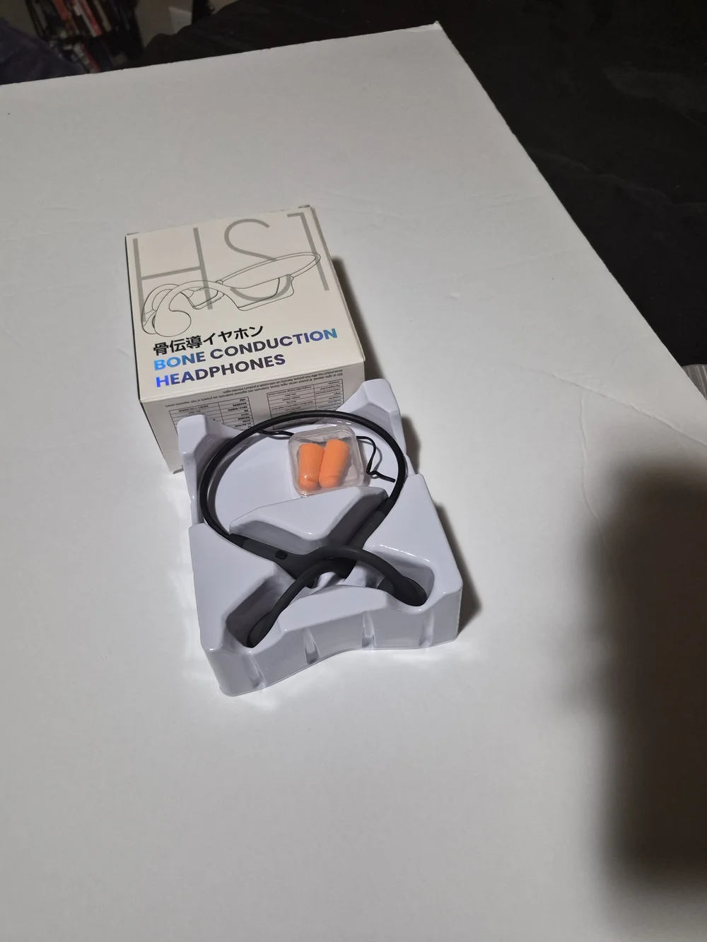 Bone Conduction Headphones in Black with Orange Earplugs